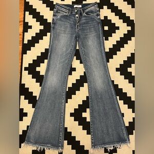 Flying Monkey flare jeans with button enclosure and frayed hem